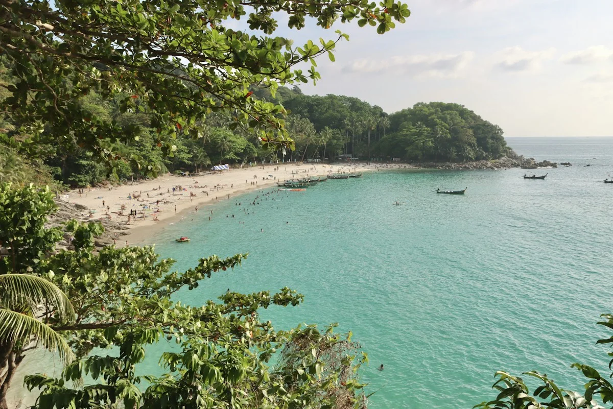 Freedom Beach in Phuket with forested headlands and turquoise water