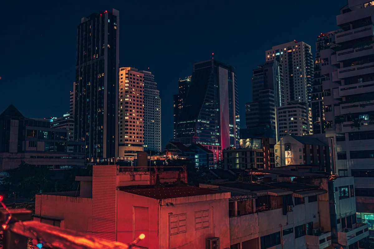 Bangkok buildings and illuminated streets viewed from a rooftop at night