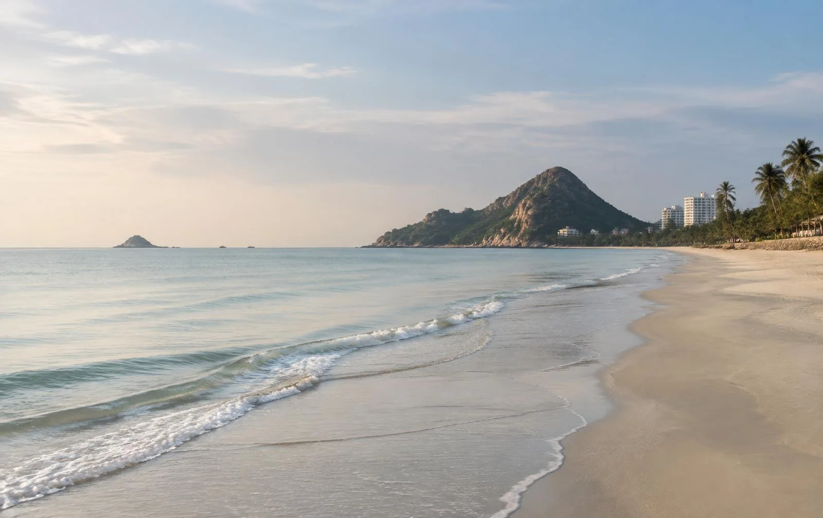 A quiet stretch of the Hua Hin coastline in soft morning light