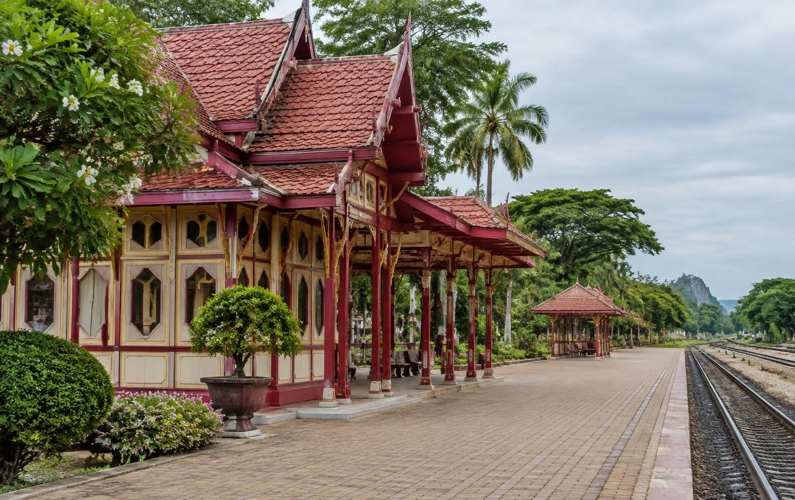 Historic Thai railway architecture beside an empty platform in Hua Hin